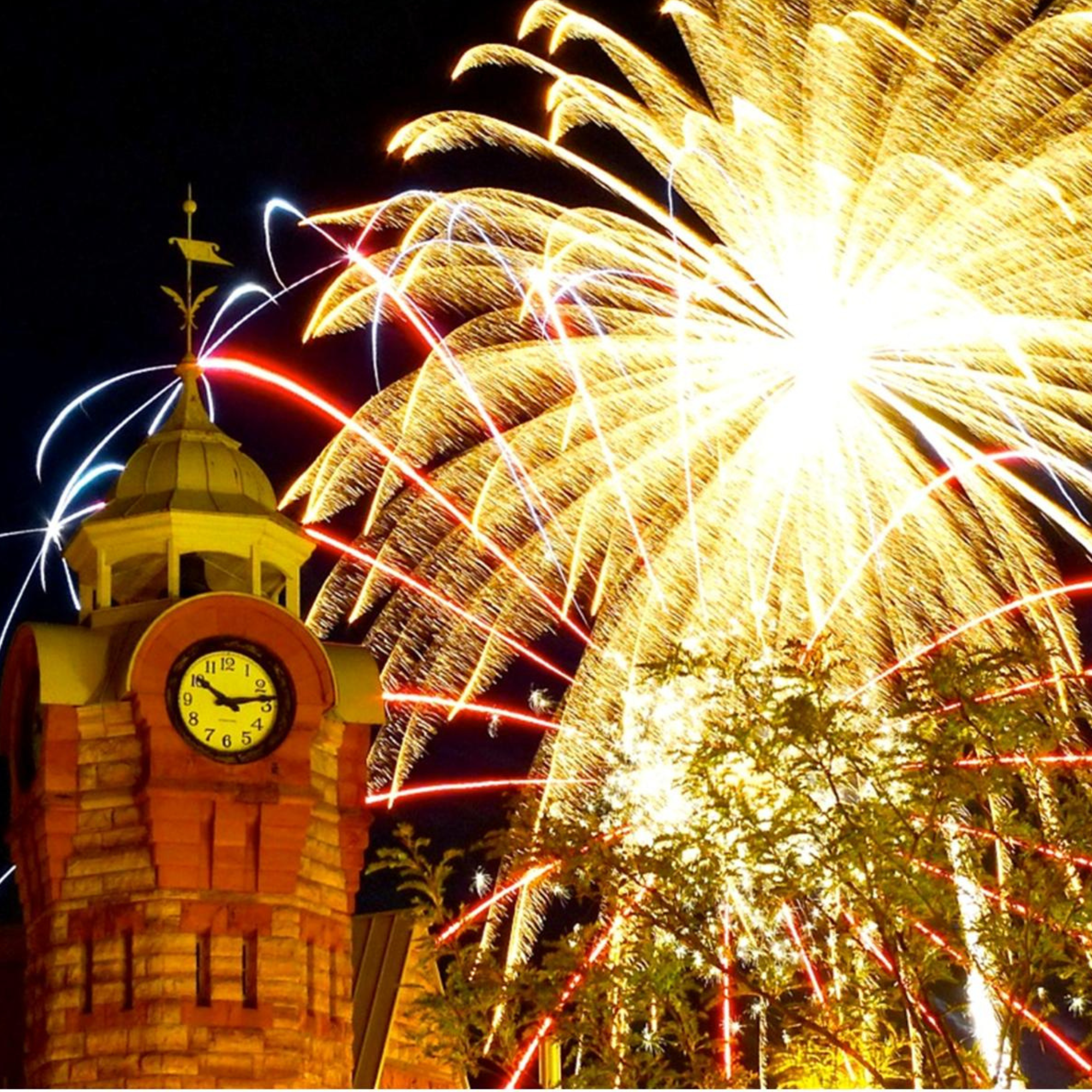 Fireworks exploding in the sky over the Arnprior clock tower