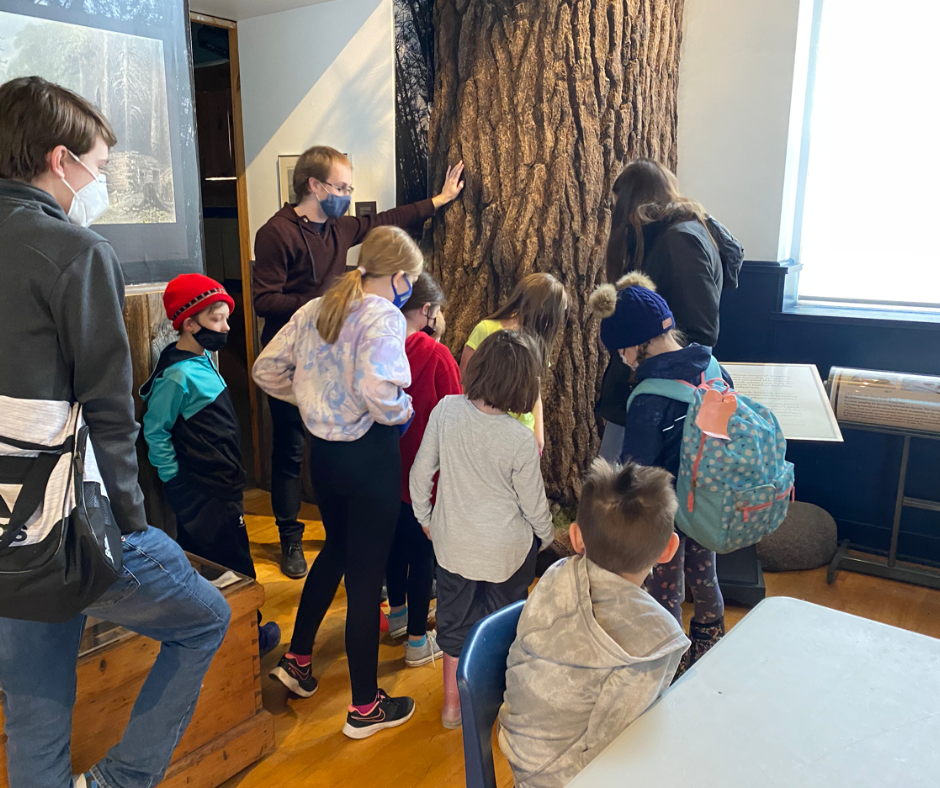 Children attending the museum camp and learning about an Arnprior artifact