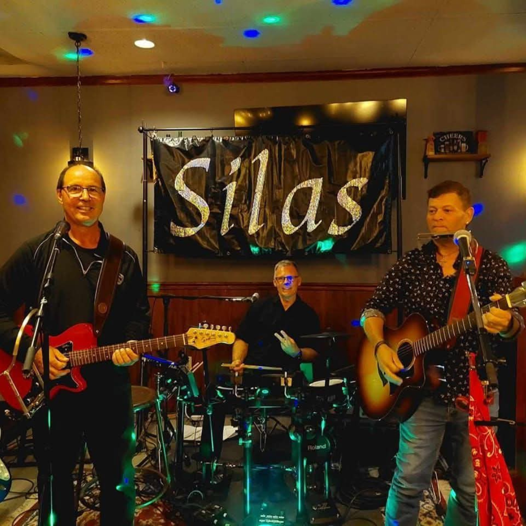 The three members of SILAS posing for photo while on set and in instrument