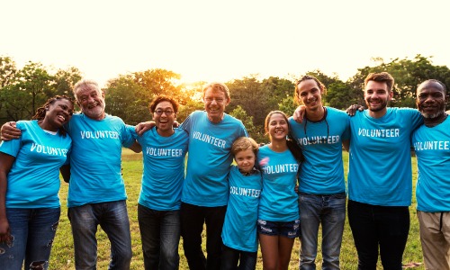 Volunteers holding hands