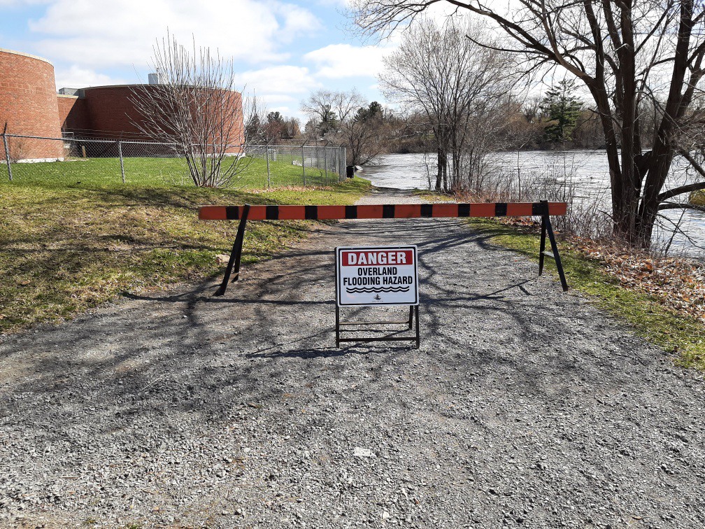 flooded trail with barricade up