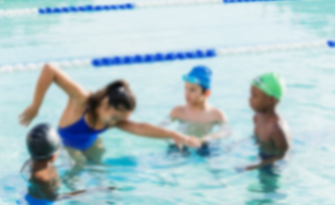 Group of kids doing swimming lessons