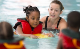 Child learning to swim