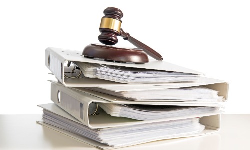 Stack of binders with gravel ontop