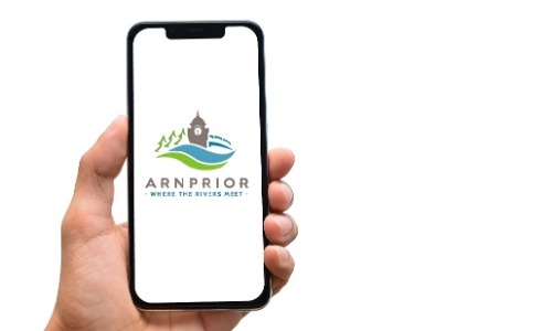 Someone holding a phone with the Arnprior logo on screen