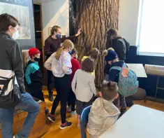 Children attending the museum camp and learning about an Arnprior artifact